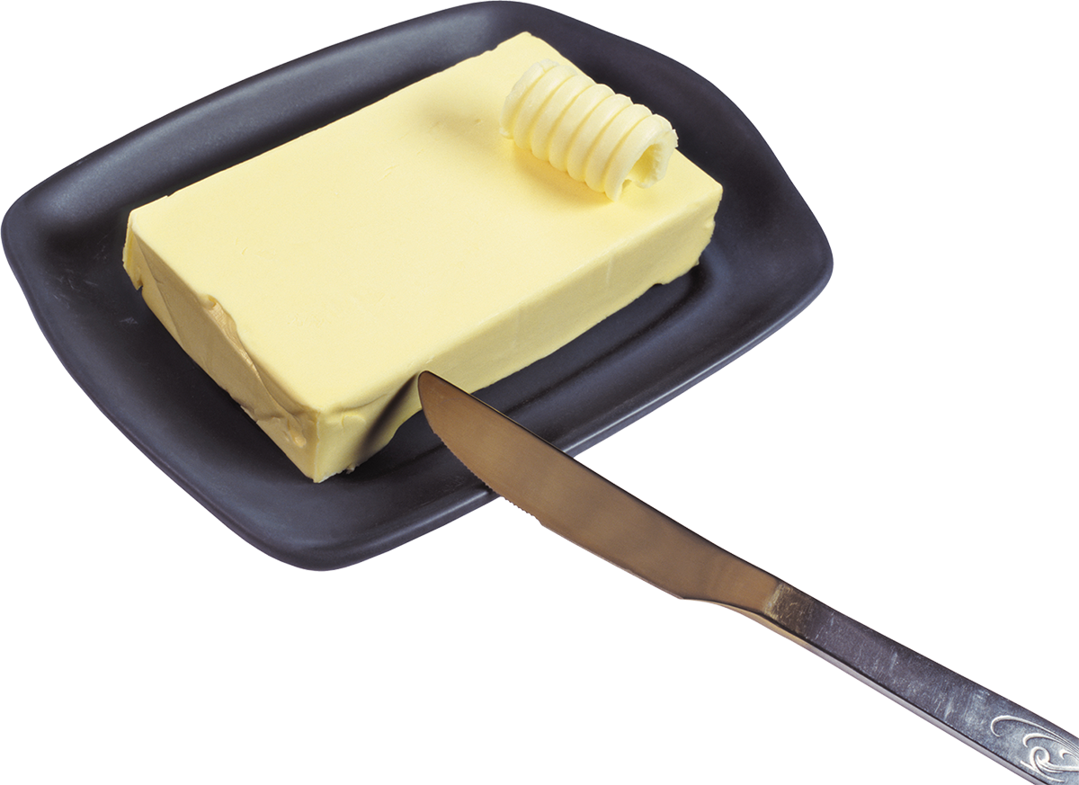 Масло в маслёнке и нож для сливочного масла. Фото